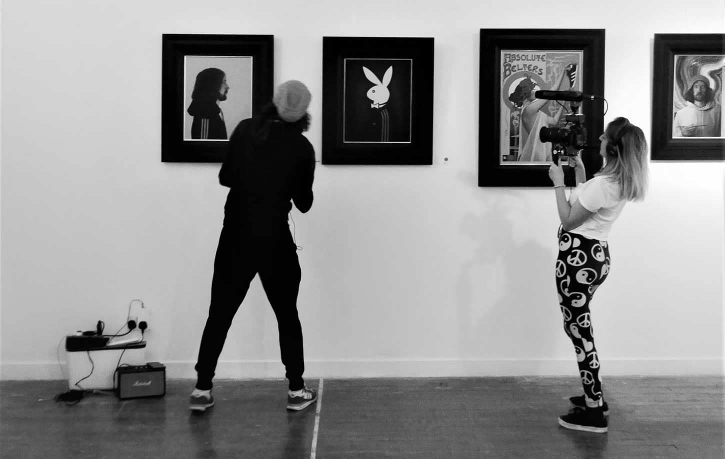 hannah-currie-ross-muir-filming Hannah Currie filming Ross Muir setting up an art exhibition